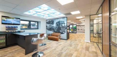 Open and airy office break area with bar