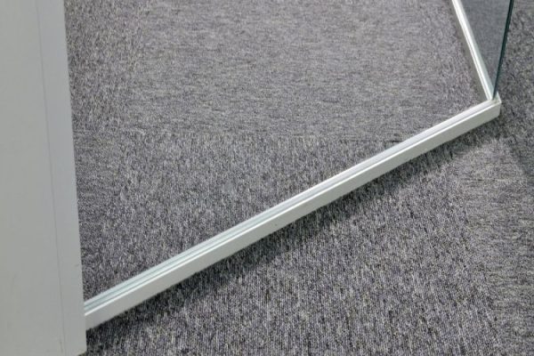 Glass door with metal fixings