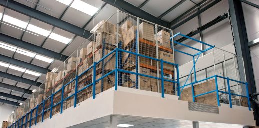 Mezzanine floor with metal caging for storage and gated lifting area