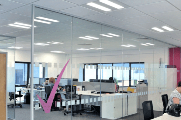 glass partition in an office space with office desks