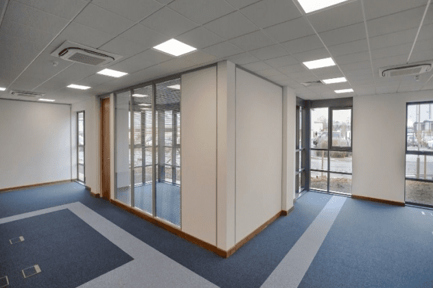 Partitioned meeting room with glass windows in office space