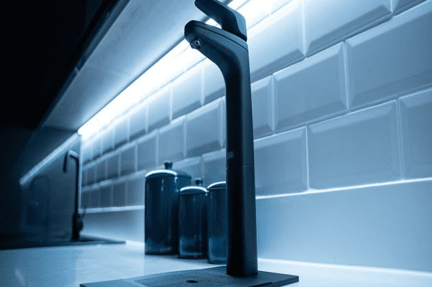 Ultra modern taps and crockery in office kitchen area